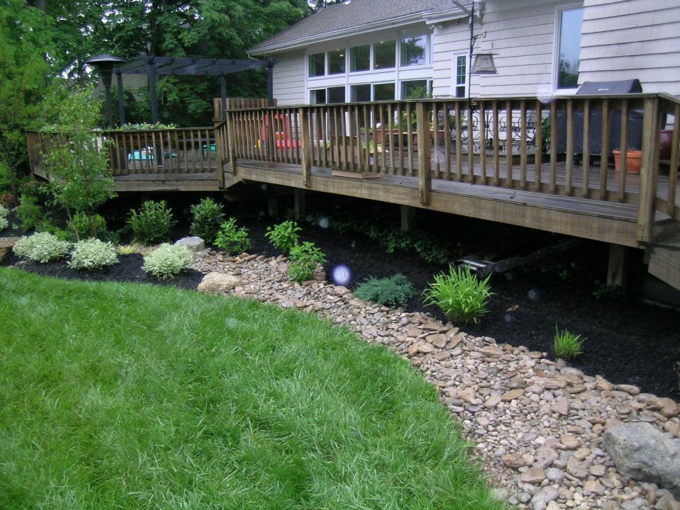 panoramic deck shot landscaped with native rocks and plants